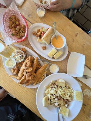 Fried Okra Basket, Fried Oyster Po'Boy with Lobster Bisque, Fish and Shrimp Platter, Cajun Chicken Pasta Alfredo