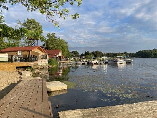 View of pontoon boats that can be rented, another two bedroom cabin and a view of Sunset Grill.