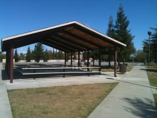 Covered area with picnic tables and barbecue grills