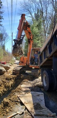 Digging for drainage at the end on a driveway that kept flooding.