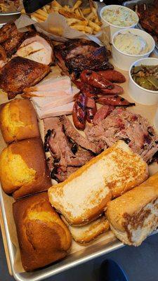 Platter of the .meats, with corn bread, garlic bread, and sides.