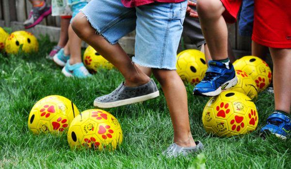 Pre-school age classes participate in Happy Feet soccer clinics.