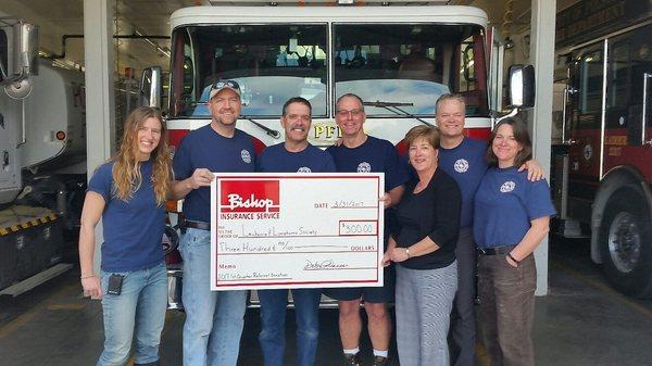 Polson Fire Department accepting donation from Debbie Vassar (Referral Program Recipients)- 2017