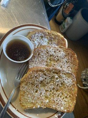 French Toast--Homemade bread, generous sliced with our special egg batter, sprinkled with powdered sugar and served with local maple syrup.