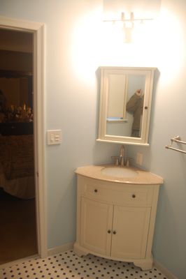 Vanity and mirror in bathroom finished