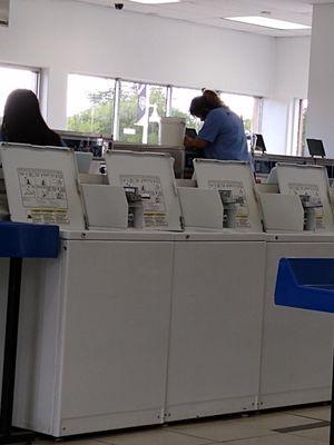 Attendant without a mask cleaning the machines