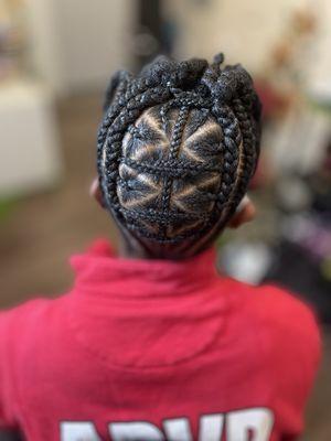 Braided updo with two-strand twists at the top