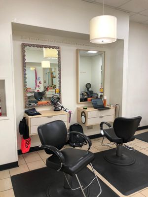 The salon stations where guests sit with stylists for their services.