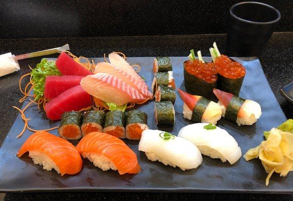 A well plated lunch of sushi and sashimi.