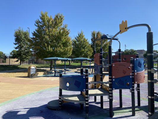 Play structure and picnic tables