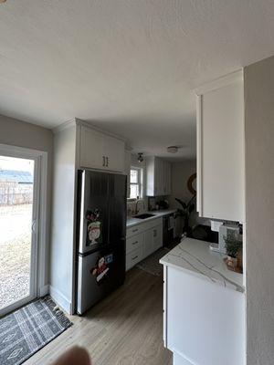 Crown molding install above the cabinets