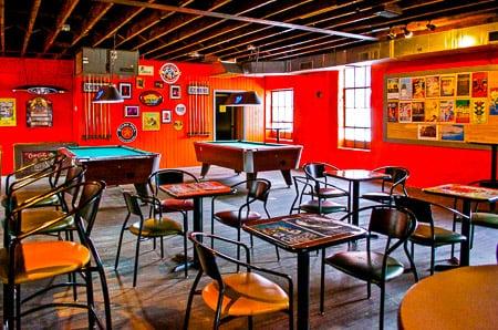 Upstairs at The Pour House. Two pool tables, chairs/tables to hang out if your feet need a break & a video feed of the stage!