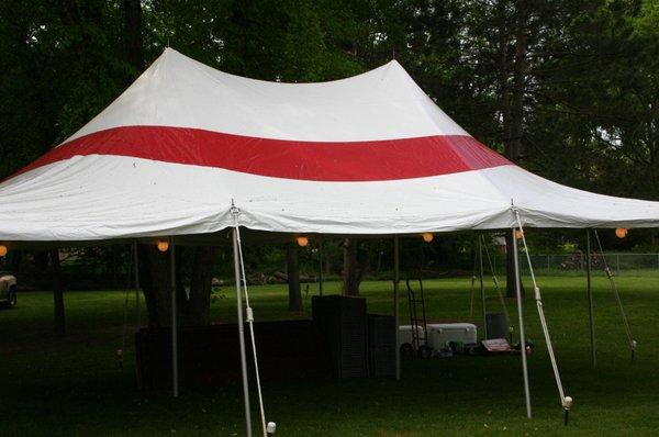 Red and white grass tent