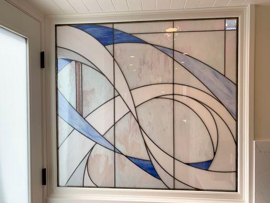 Custom abstract leaded glass panel for renovated kitchen in a home by Lake Washington