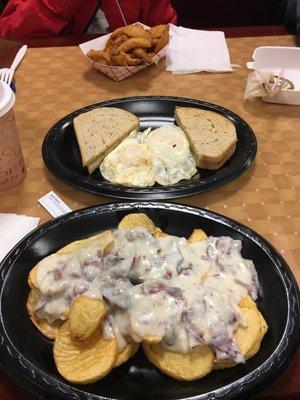 All day breakfast. Creamed Chipped Beef on crispy potato rounds, two fried eggs and rye toast. Side of onion rings. Excellent.