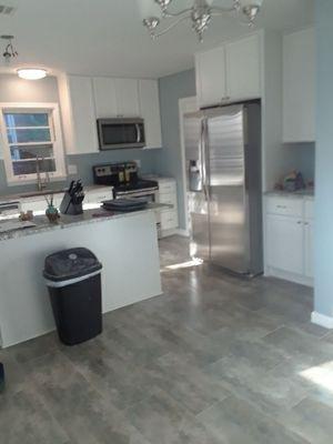 This kitchen had paneling walls a divider wall and furdowns, not any more.