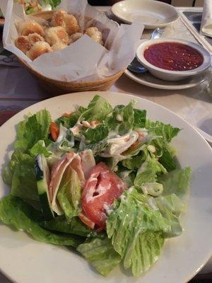 Delicious salad and garlic knots.