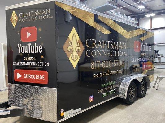 Drivers fronr rear corner of Craftsman Connection trailer with new Zilla wrap job.