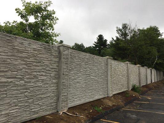 Stone tree concrete fence.