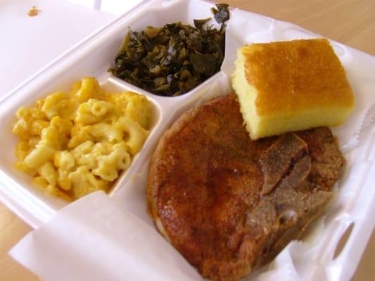 Bone-in pork chop, collards, mac-n-cheese, and corn bread