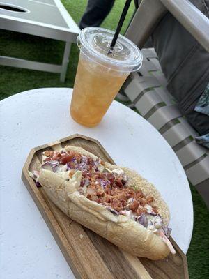 Carolina dog and a southern Fixz cocktail outside in the shade.