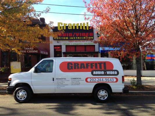 one of own new vans in front of the shop