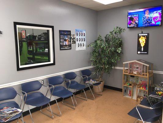 Lobby area with tv, playhouse for the kiddos and they offer WiFi.