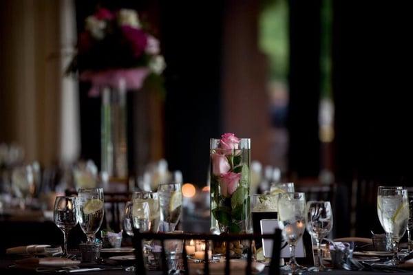 Flowers for tables at Independence Grove wedding (tall arrangement in background, underwater flower arrangement in front)