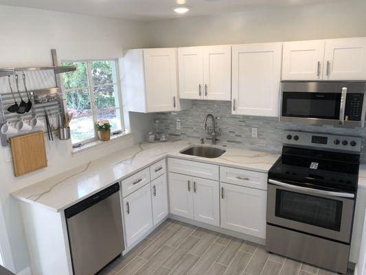 Quartz countertops and white shaker cabinets. Simple remodel in Sarasota