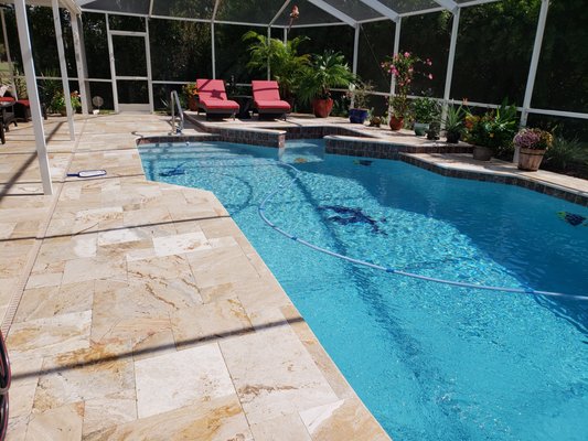 Leonardo travertine. Instead of using a skimmer cover he uses a piece of travertine as the cover. It blends in perfectly.