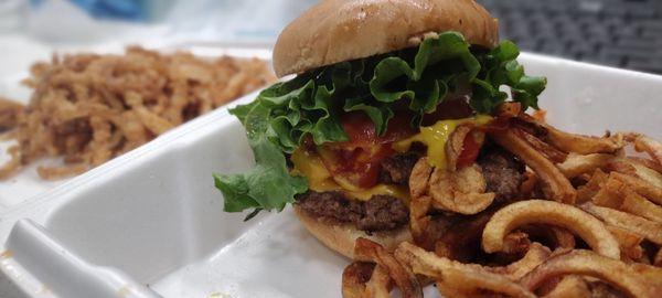 Double cheeseburger, curly fries and home made onion rings.