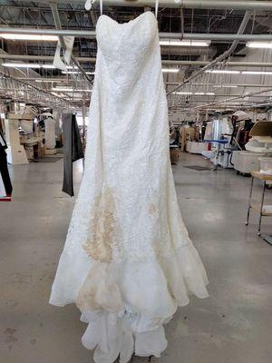 badly stained wedding dress brought to us