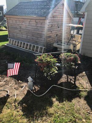 Beginning of project. Adding garden bed and rose of sharon plants to act as a privacy fence.