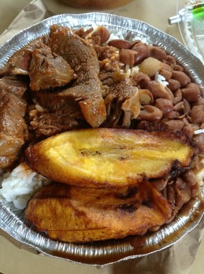 Beef stew with rice and beans, plantains. Tasty!