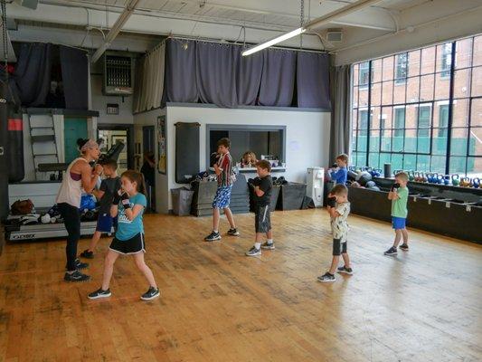 Trainer Karen teaching out Boxfit Kids class