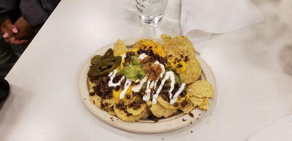 Tjis is the carne asada which is grown beef. And cheep round bag nachos. You can get better at the movies and cheaper too.