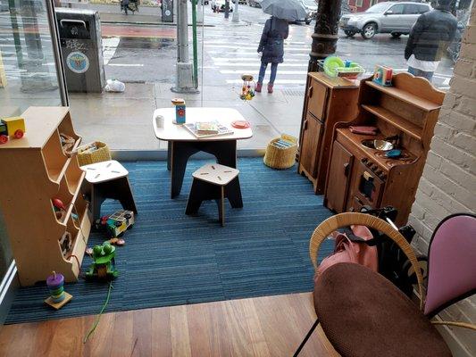 Tiny play area for kiddies while they wait.