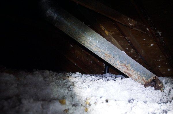 Roof leak has eroded water heater/furnace vent allowing toxic gas enter the structure.