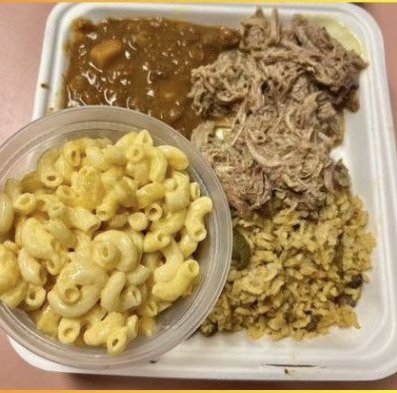 Pulled pork combo with rice, beans & mac & cheese.