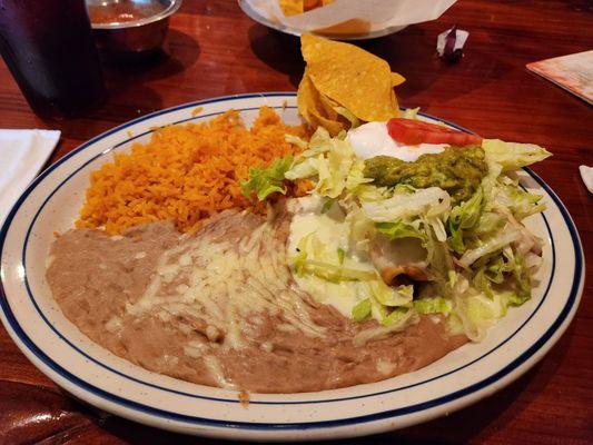 Chicken chimichanga with rice and beans.