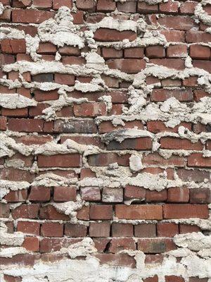 Check out the cool brick work on the buildings wall outside