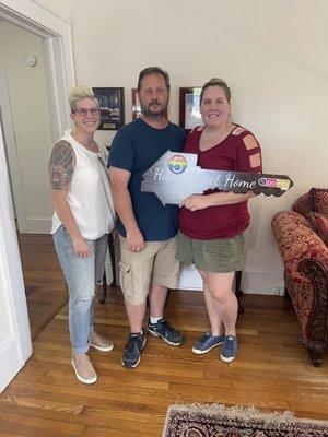 April Crigger-Hudson with buyer clients, Lonnie and Ashley!