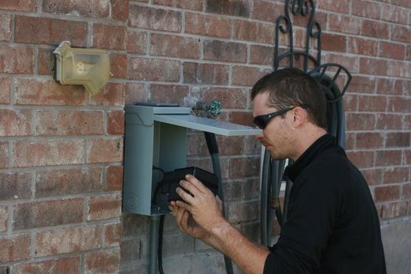 Co - Owner installing a specialized transformer