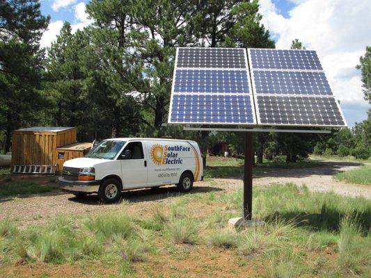 A small pedestal ground mount for an off-grid cabin