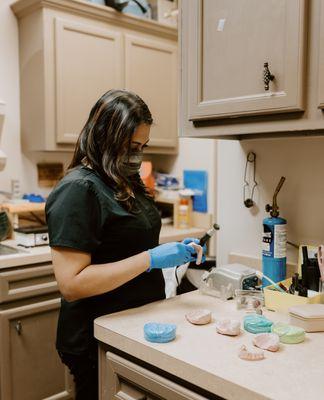 One of our registered dental assistants completing work in the Timeless Dental Laboratory.