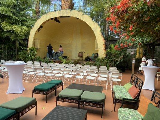 White folding chairs, cocktail tables