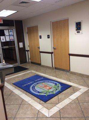 Entrance of library, has an “after lunch at a high school” odor.