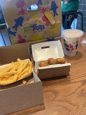 Chicken bites n fries with black n white small shake.