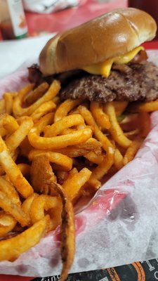 Bacon cheeseburger with curly fries.