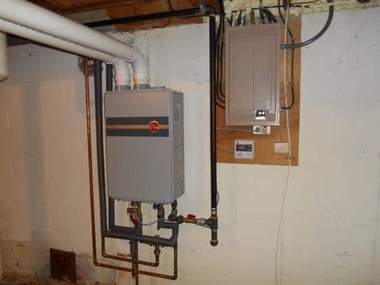 RHEEM 95% efficient condensing tank-less water heater.